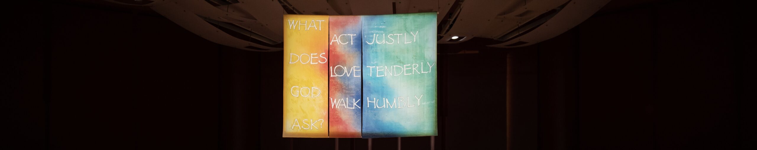 Banner with the text What does God ask? Act Justly, Love tenderly, Walk humbly
