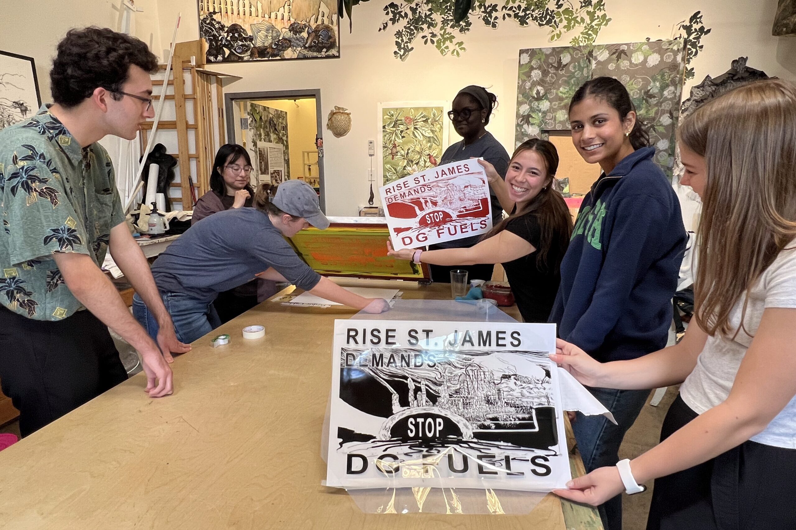 Students on the Cancer Alley trip make prints for the faith-based grassroots organization Rise St. James